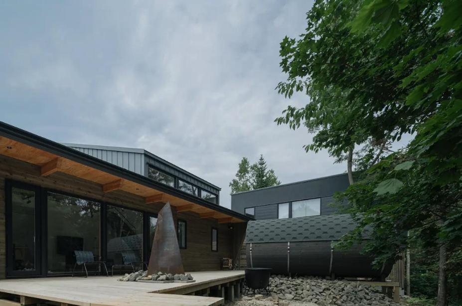a modern house with a patio in front of it at The VILLA KAORU in Otaru