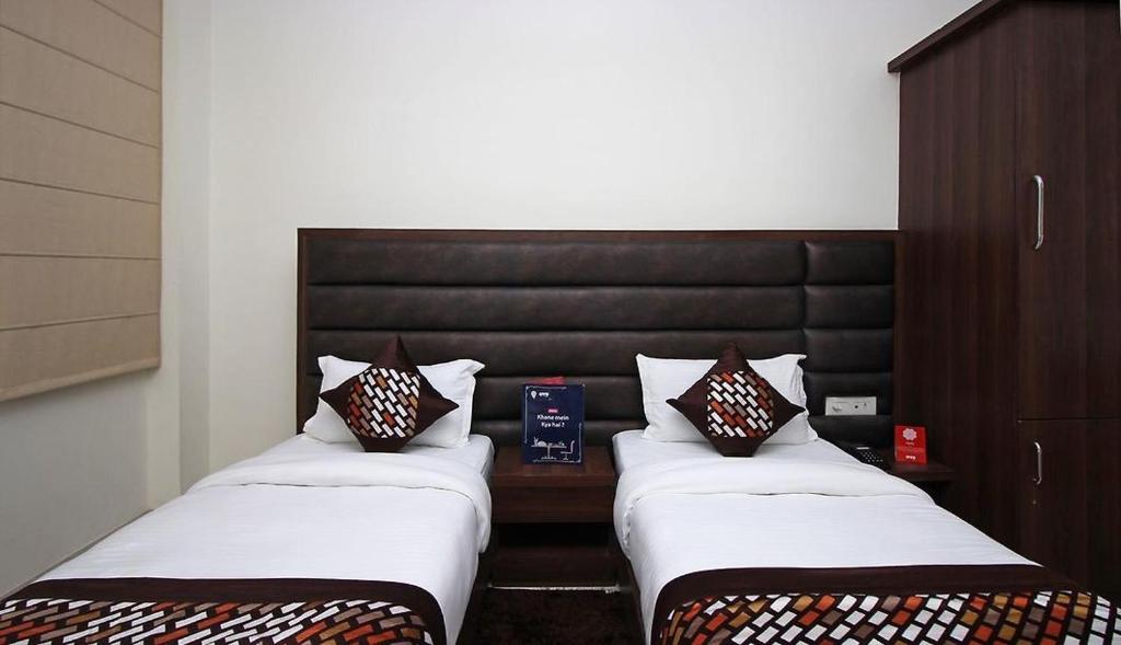 Postel nebo postele na pokoji v ubytování Hotel Opal Courtyard