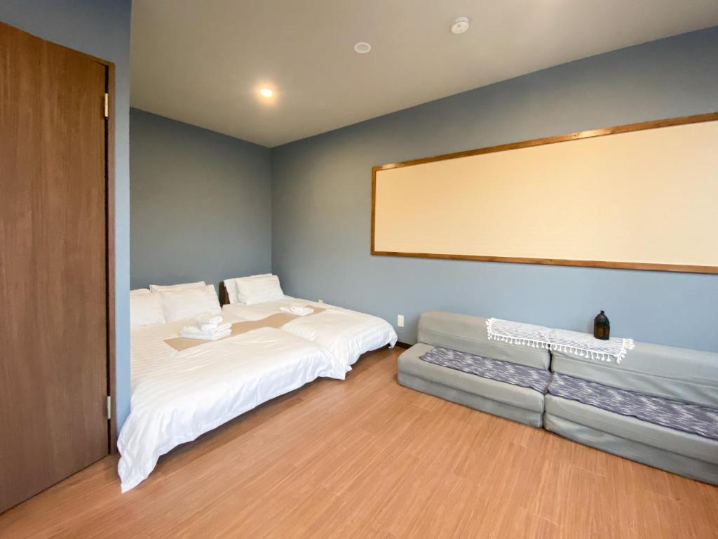 Postel nebo postele na pokoji v ubytování Tomi Home 2F