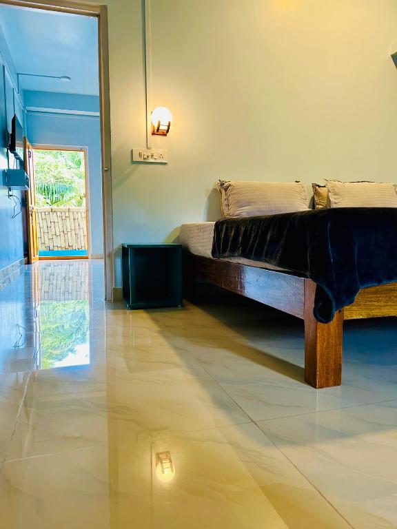 a bedroom with a bed in a room at Bhūma in Havelock Island