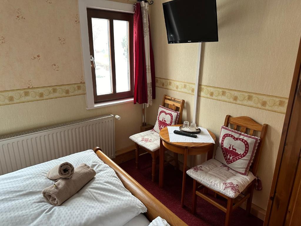 Postel nebo postele na pokoji v ubytování Weißer Stein Jonsdorf