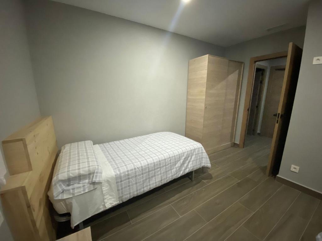 Postel nebo postele na pokoji v ubytování Casa Orensanz