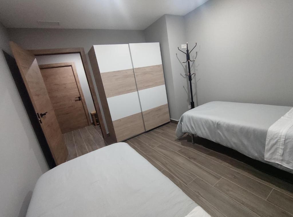 Postel nebo postele na pokoji v ubytování Casa Orensanz