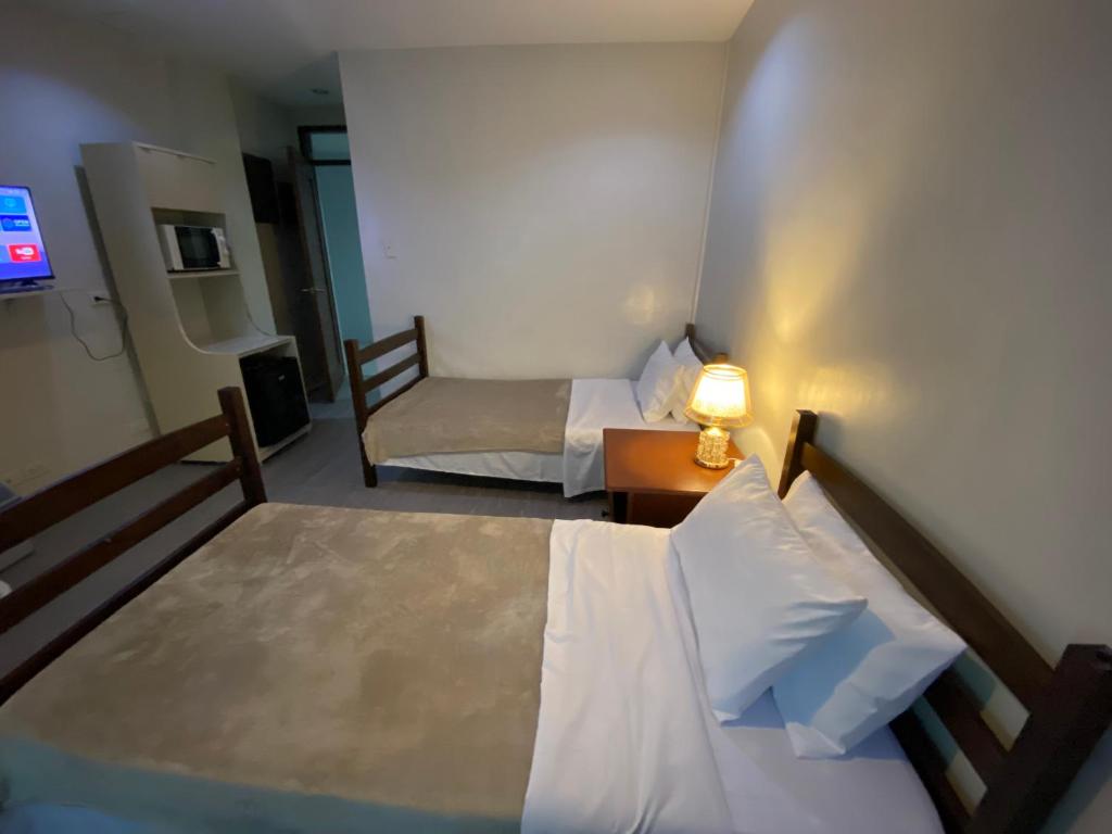 Postel nebo postele na pokoji v ubytování ABE Lodge Taguig