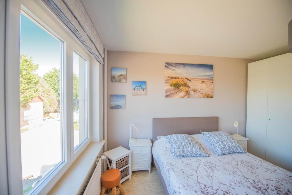 Postel nebo postele na pokoji v ubytování B&B De Kleine Prins