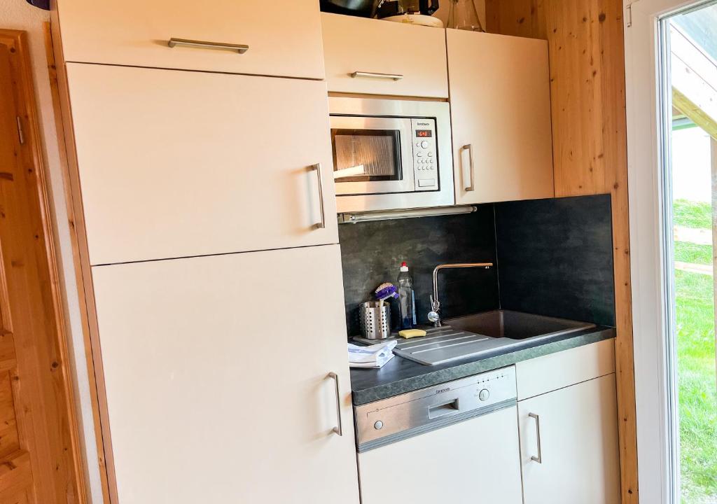 Kuchyň nebo kuchyňský kout v ubytování 1A Chalet Nest - Grillen, Wandern, Panorama Sauna!