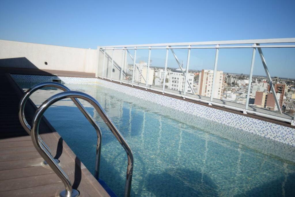 a swimming pool on the roof of a building at Departamento Margaritas in Santa Rosa