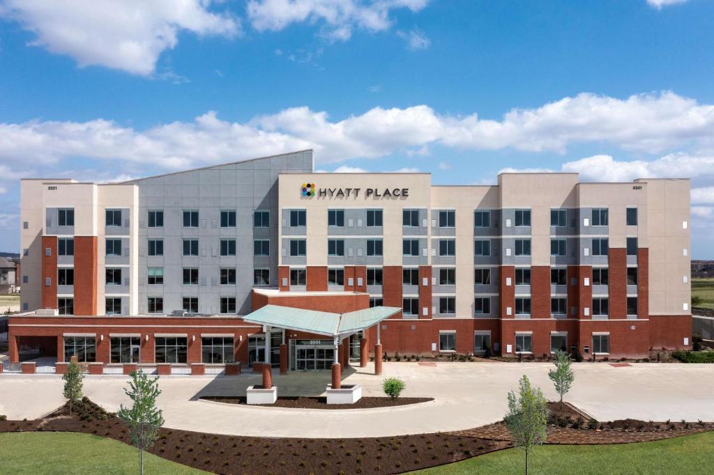 a large building with a sign that reads swift place at Hyatt Place Fort Worth-Alliance Town Center in Fort Worth