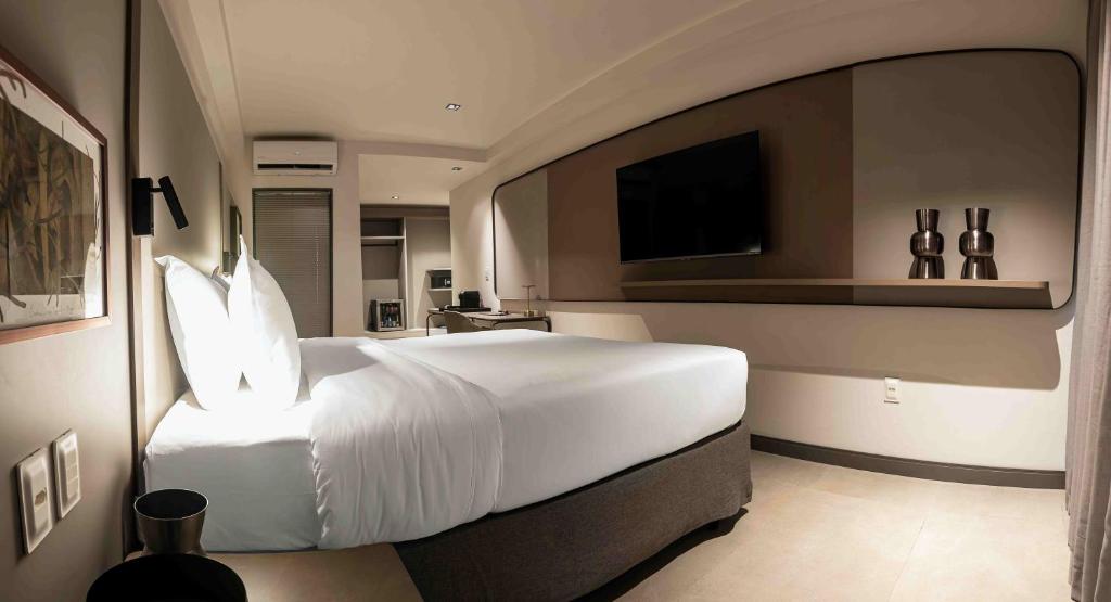 Cama ou camas em um quarto em HCM - Hotel Corais de Manaira