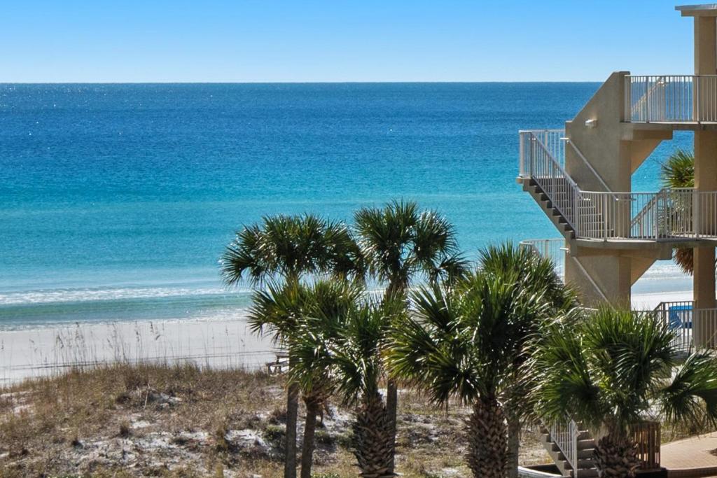 a view of a beach with palm trees at SunDestin 416 in Destin
