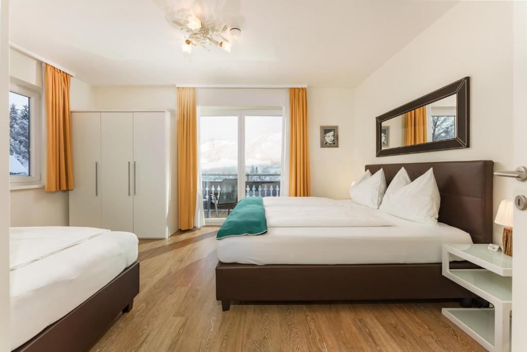 Säng eller sängar i ett rum på Bella Vista Appartements by Schladming-Appartements