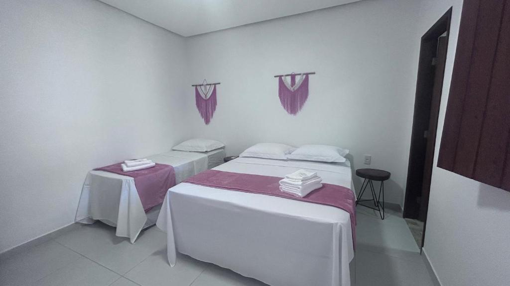 Cama ou camas em um quarto em Pousada Estrelar
