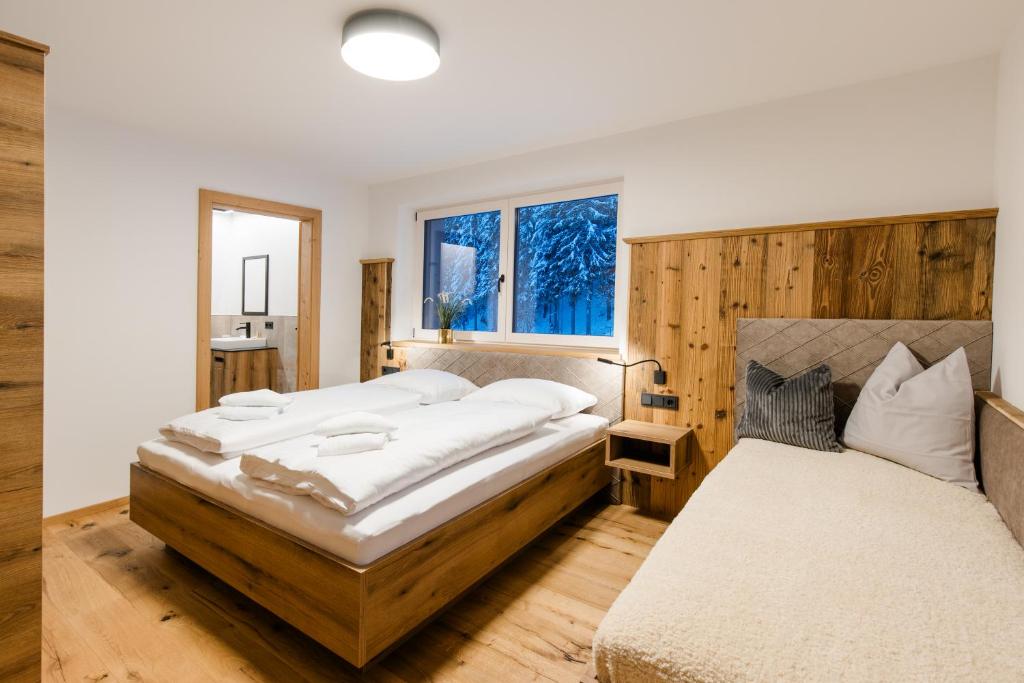 Postel nebo postele na pokoji v ubytování ANN SUITES Appartements