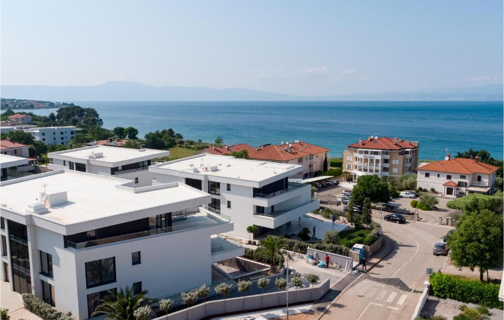 an aerial view of a city with the ocean at Beautiful Apartment In Malinska in Malinska