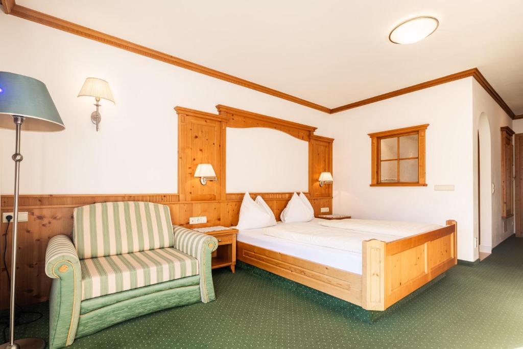 Postel nebo postele na pokoji v ubytování Hotel Sonnenhof