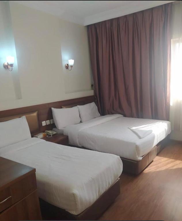 Posteľ alebo postele v izbe v ubytovaní Hotel Multan