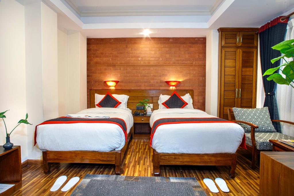 Postel nebo postele na pokoji v ubytování Taleju Boutique Hotel