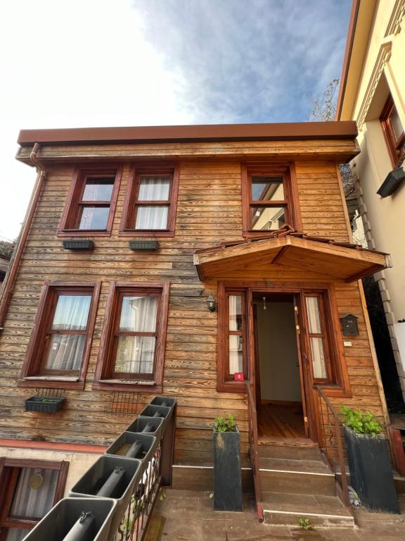 a wooden house with the front door open at Lux sea view willas in Istanbul