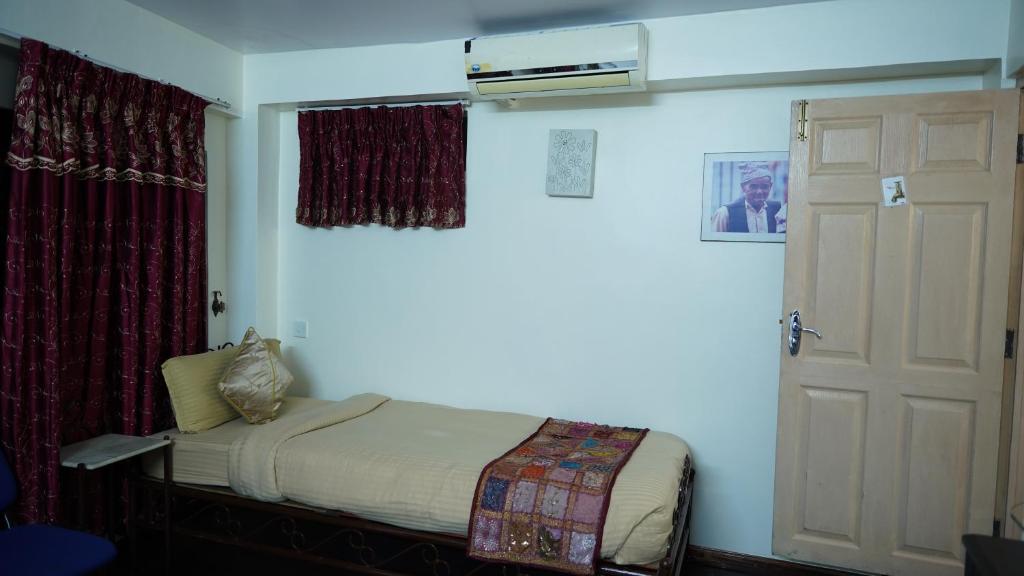Postel nebo postele na pokoji v ubytování Cosy Hotel