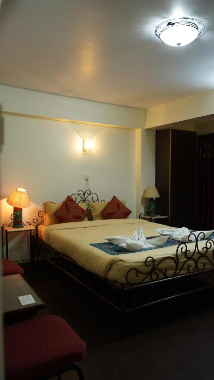Postel nebo postele na pokoji v ubytování Cosy Hotel