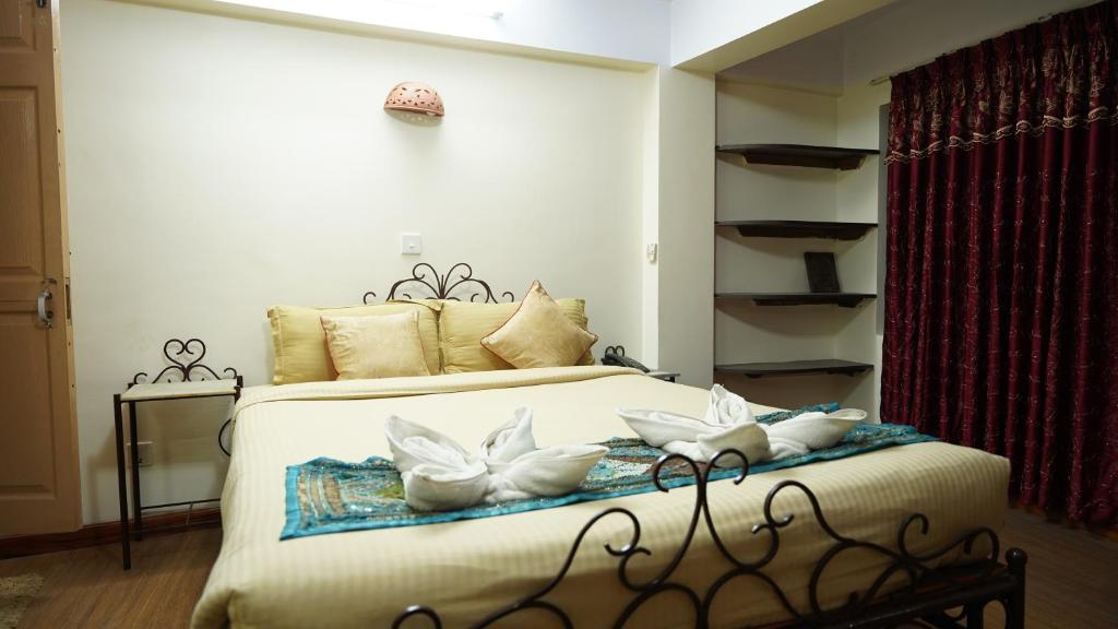 Postel nebo postele na pokoji v ubytování Cosy Hotel