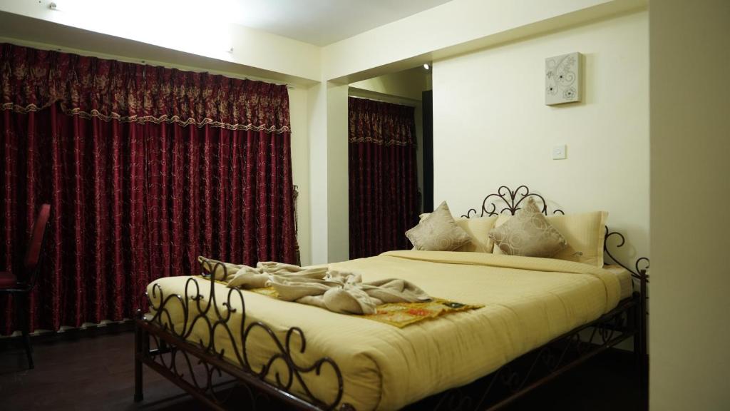 Postel nebo postele na pokoji v ubytování Cosy Hotel