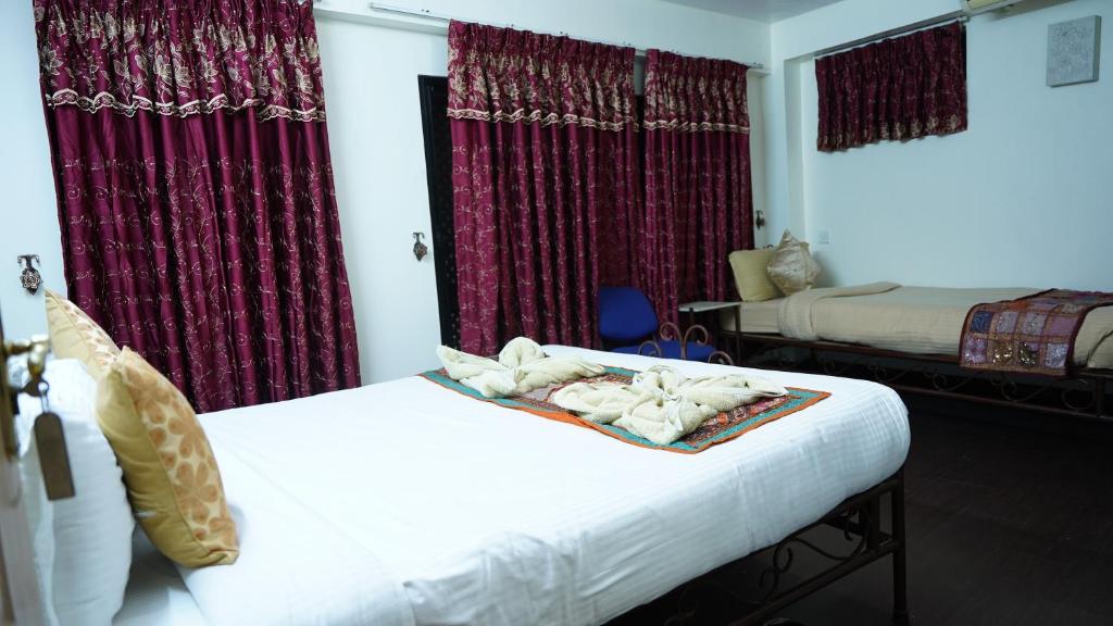 Postel nebo postele na pokoji v ubytování Cosy Hotel