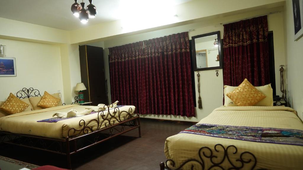 Postel nebo postele na pokoji v ubytování Cosy Hotel