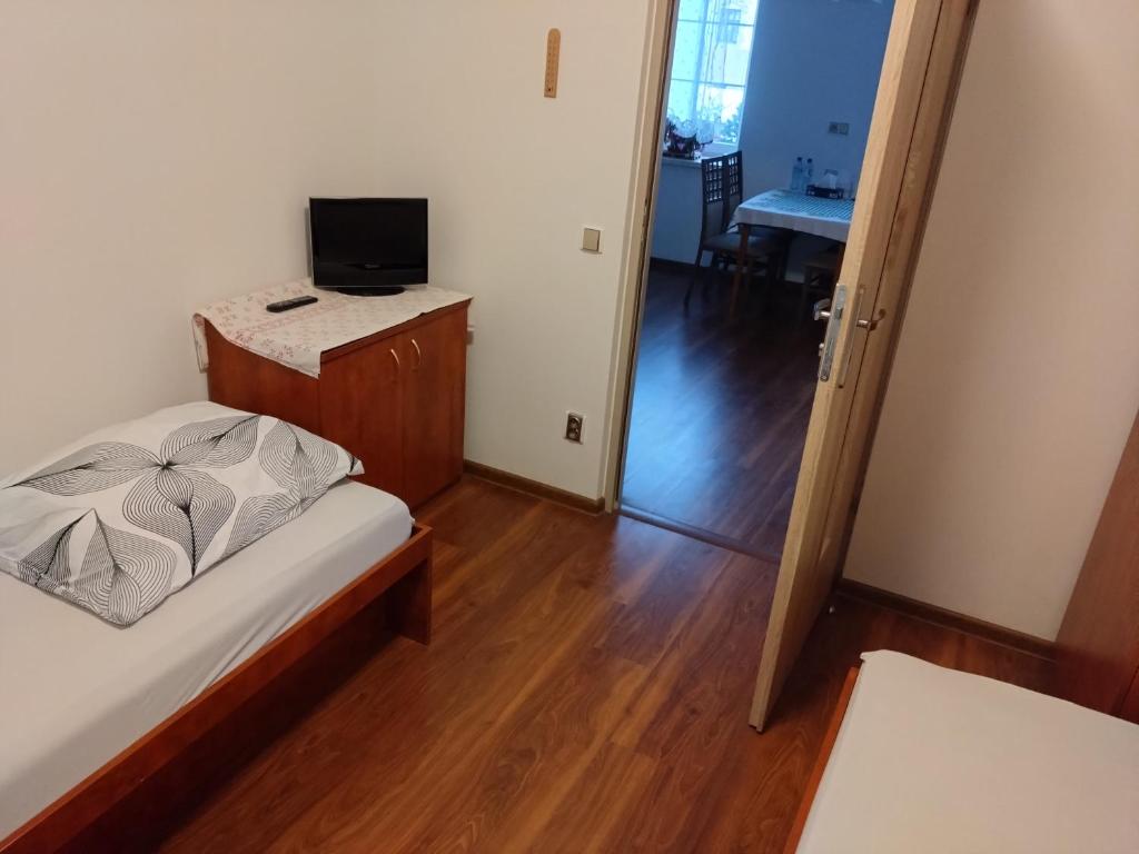 Postel nebo postele na pokoji v ubytování Apartmány u Martina