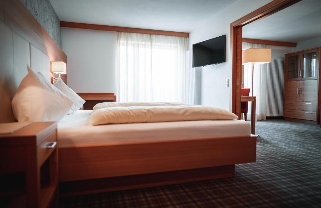 Postel nebo postele na pokoji v ubytování Hotel Sonnenhof