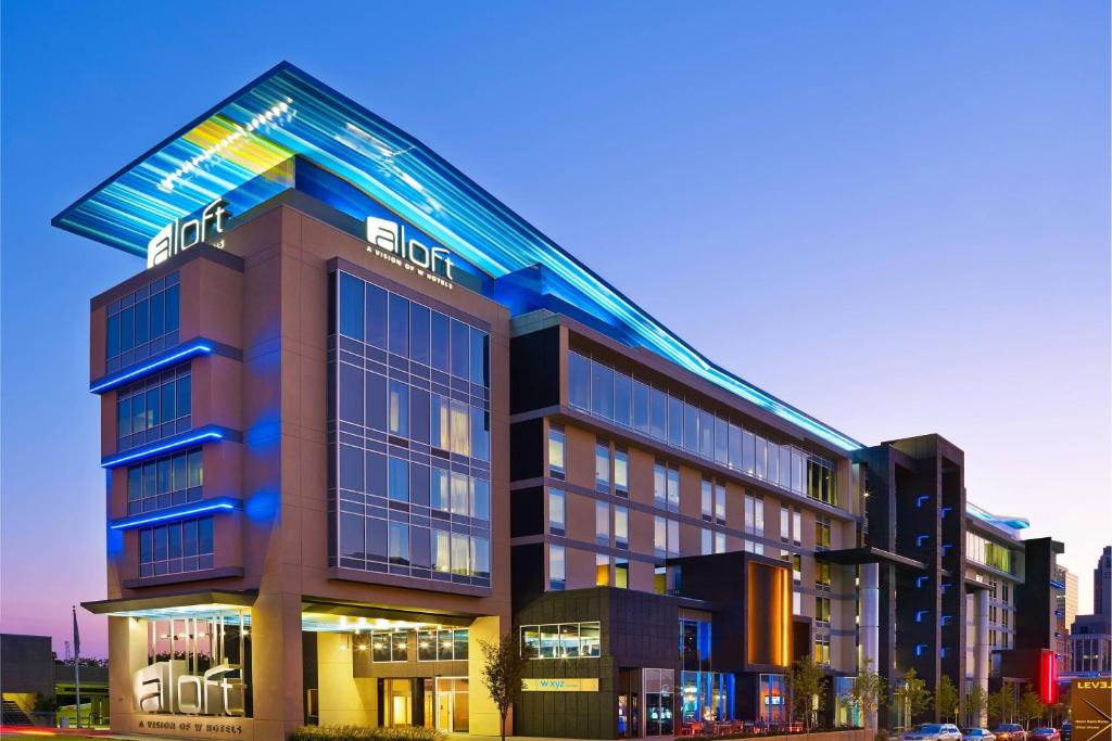 a hotel building with a sign on top of it at Aloft Oklahoma City Downtown – Bricktown in Oklahoma City