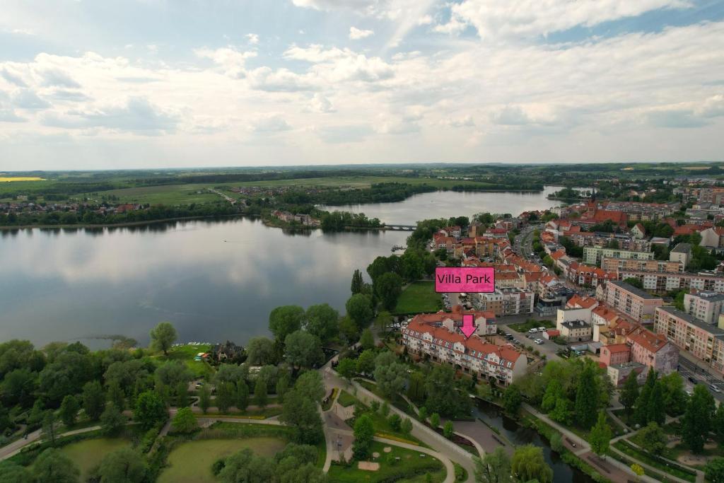 an aerial view of a city with a lake at Apartament z dziedzińcem koło rzeki in Ełk