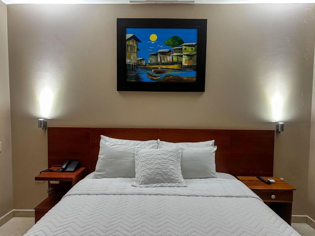 Postel nebo postele na pokoji v ubytování Hotel Bucaneiro