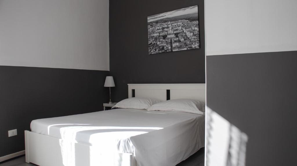Postel nebo postele na pokoji v ubytování DUCEZIO rooms