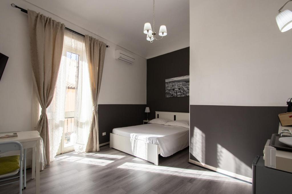 Postel nebo postele na pokoji v ubytování DUCEZIO rooms