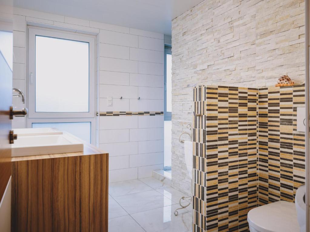 Kúpeľňa v ubytovaní Appartements Enzian by we rent