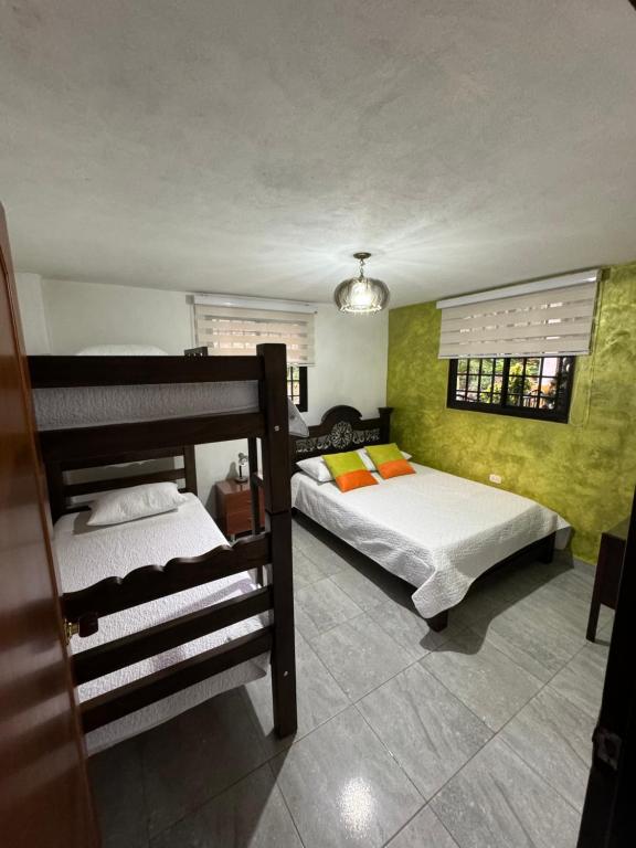 A bed or beds in a room at El Mortiño