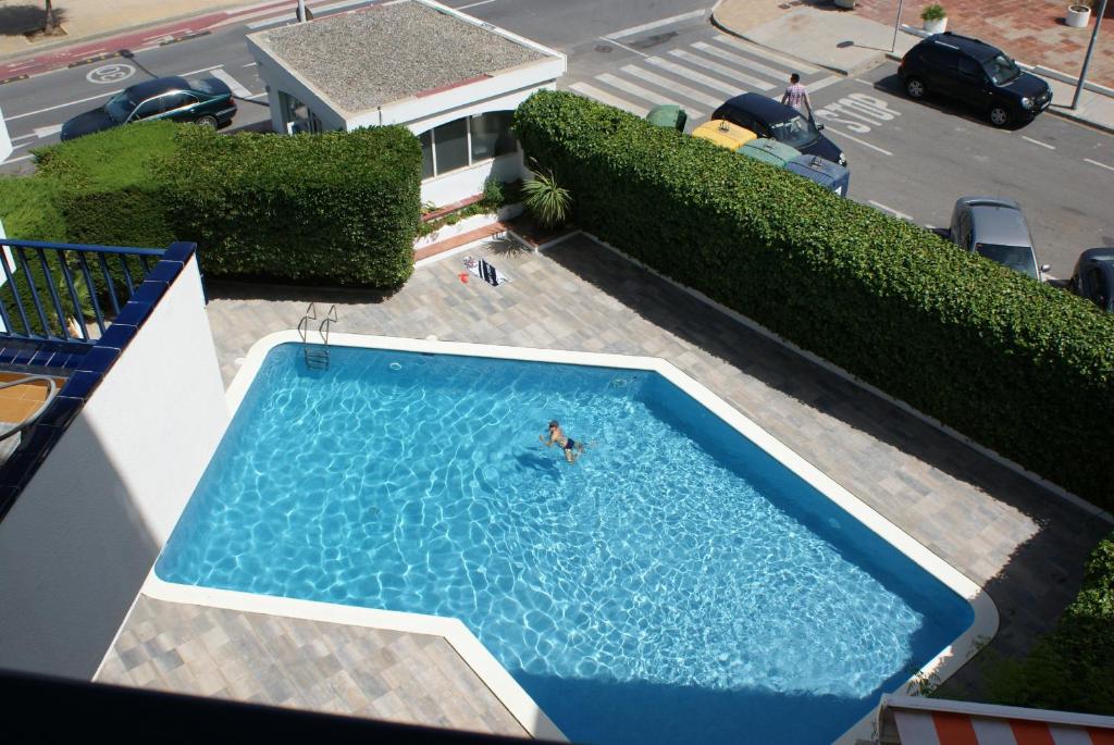 Bazén v ubytovaní Passeig Del Mar - apartamentos primera linea alebo v jeho blízkosti