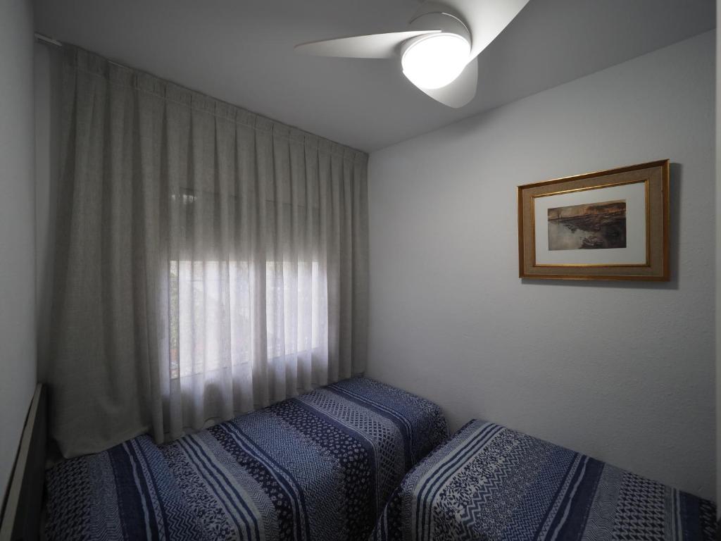 Postel nebo postele na pokoji v ubytování InmoSantos Oasis A1