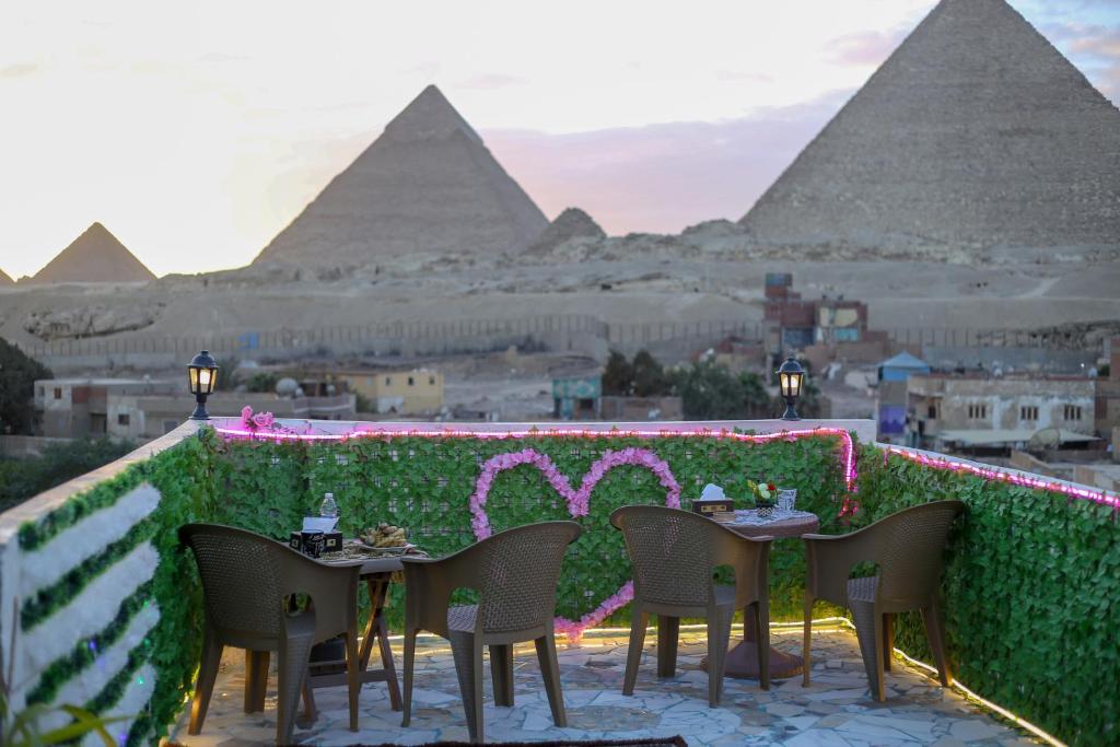 a restaurant with a view of the pyramids at pyramids show hotel in Cairo