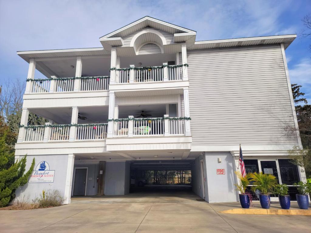 a large white building with a balcony at Beaufort Harbour Suites and Lodges in Beaufort