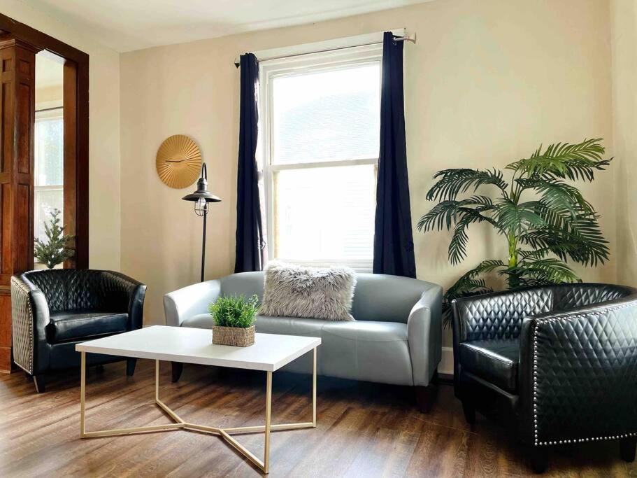 a living room with a couch and two chairs and a table at Abode à la Mode / Centrally Located 2BR/1BA Home in Evansville