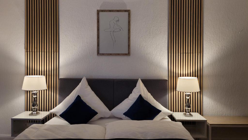 Säng eller sängar i ett rum på Gästehaus Föhr