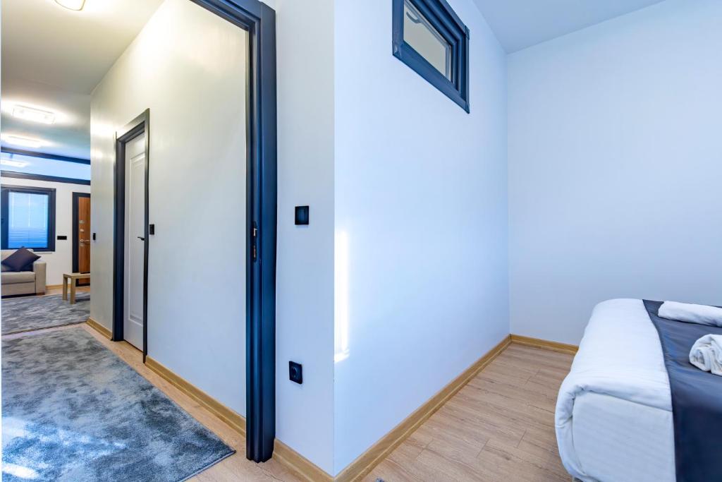a room with a bed and a sliding glass door at Mia Mia Suites in Istanbul