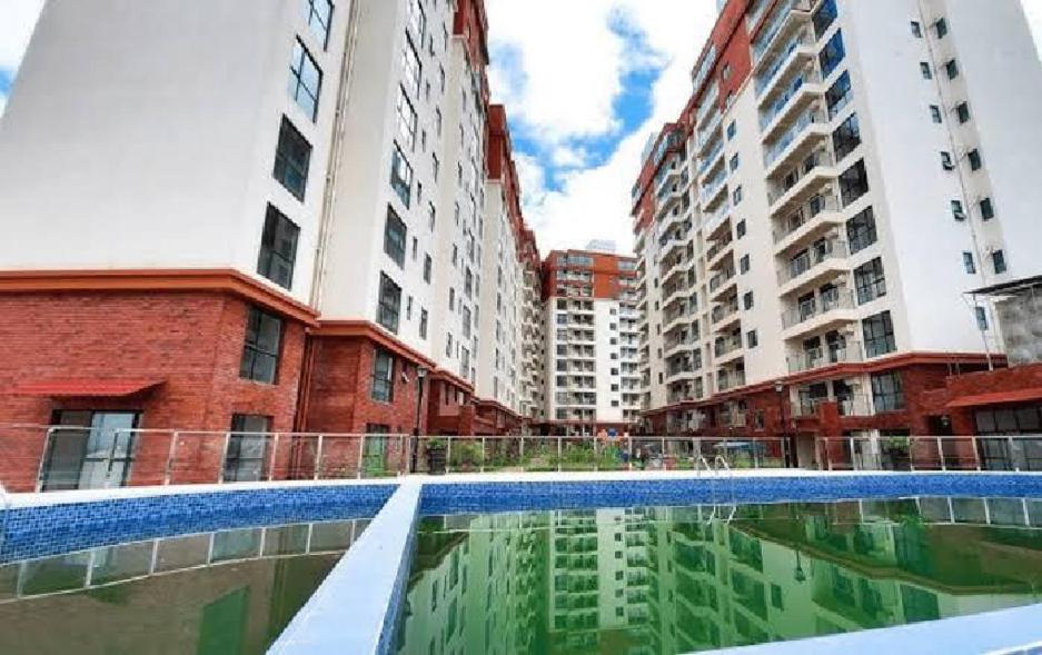 a pool of water in front of some buildings at Apple Tree Apartment - 3beds -3Bedroom - 4 Washroom in Nairobi