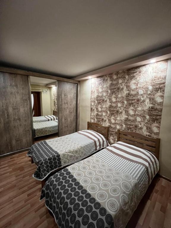 Postel nebo postele na pokoji v ubytování Guest House Imereti