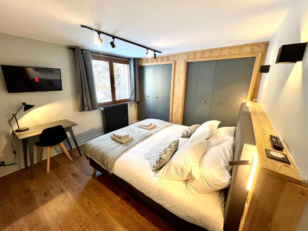 Postel nebo postele na pokoji v ubytování Appartements Chalet Lauranoure Centre Station
