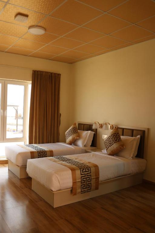 Postel nebo postele na pokoji v ubytování Lina Dreamland Resort