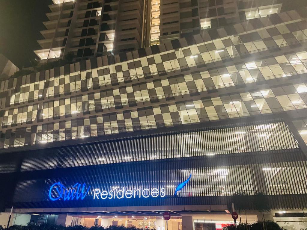 a building with a sign on the side of it at Quill Residences A&P KLCC in Kuala Lumpur