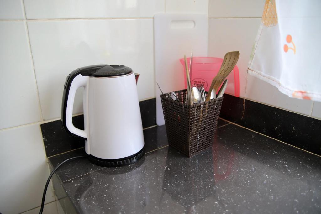 a coffee pot sitting on top of a counter at Safari Stays Staycation Homes in Ngong